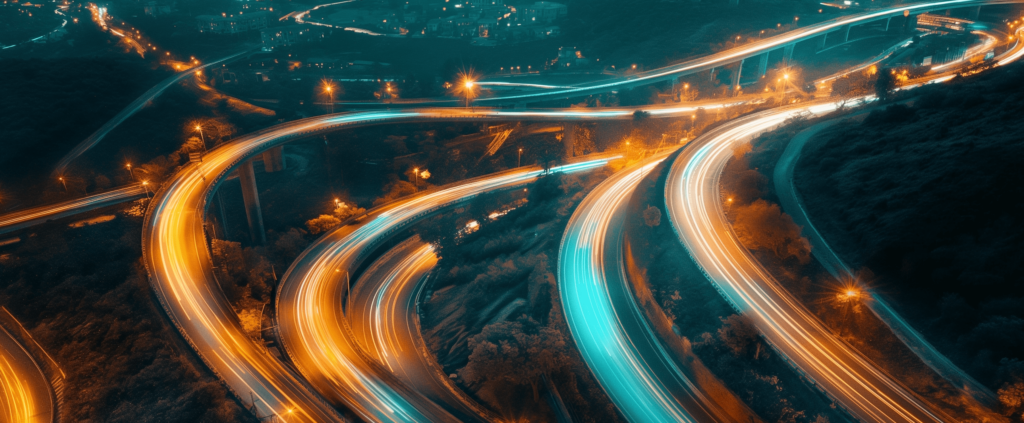 Aerial view of illuminated highway at night.
