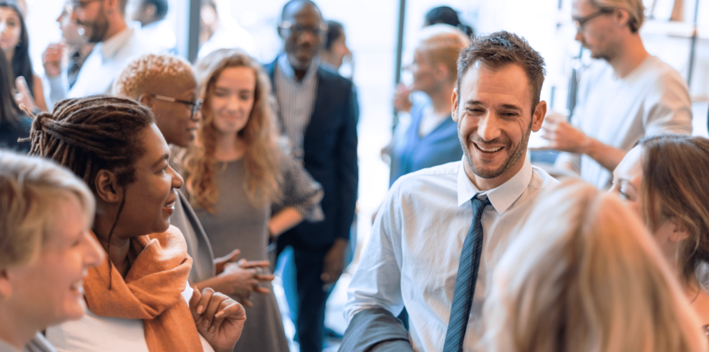 Diverse group of business people networking at a social event.